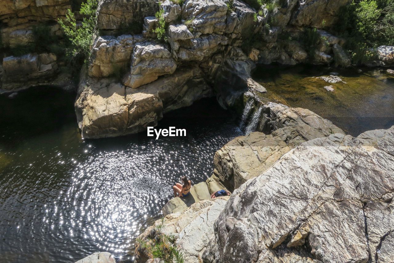 HIGH ANGLE VIEW OF ROCKS AND RIVER