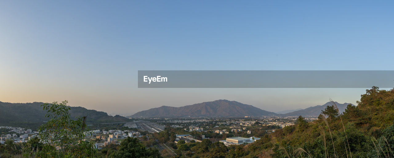 Scenic view of mountains against clear blue sky