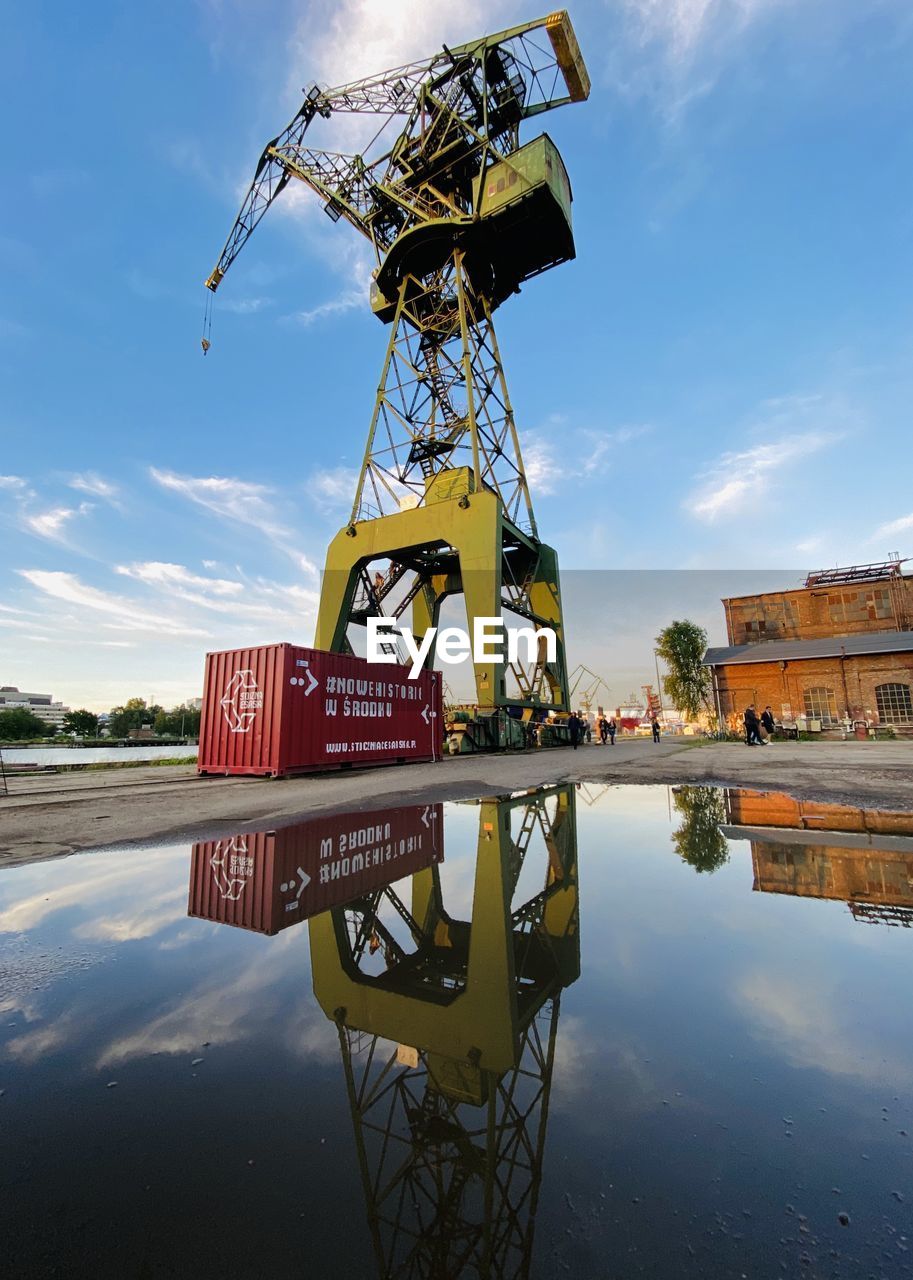 INFORMATION SIGN ON LAKE AGAINST SKY