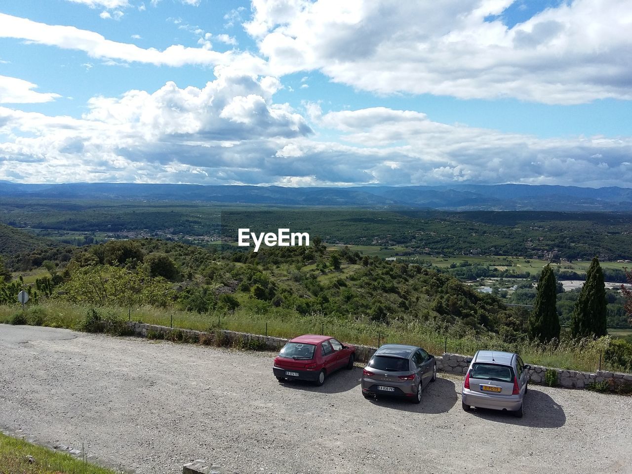 SCENIC VIEW OF MOUNTAINS AGAINST CLOUDY SKY