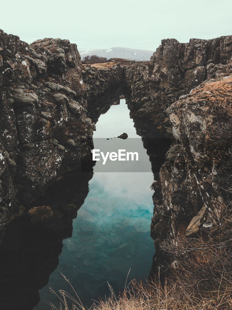 Idyllic shot of rock formation against sky