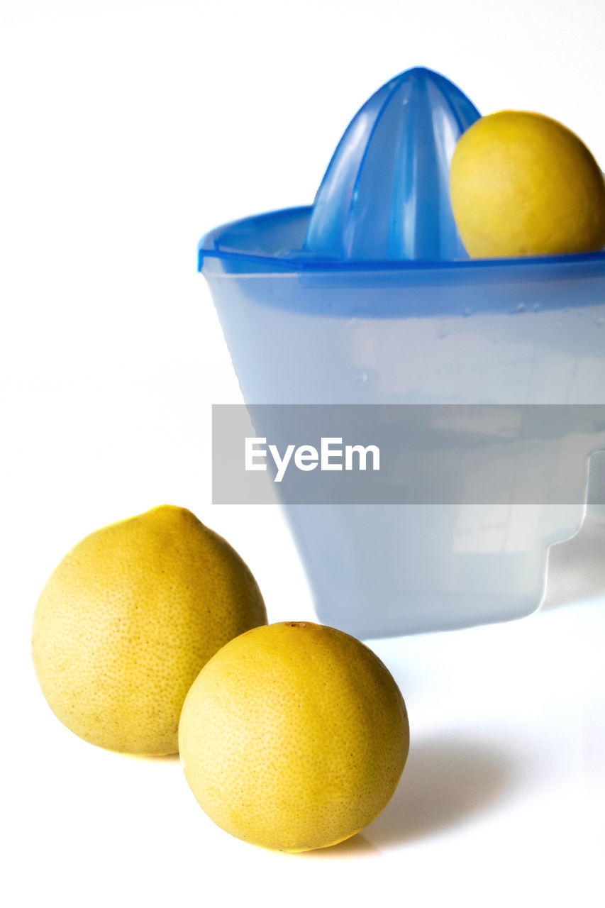 CLOSE-UP OF LEMON ON TABLE