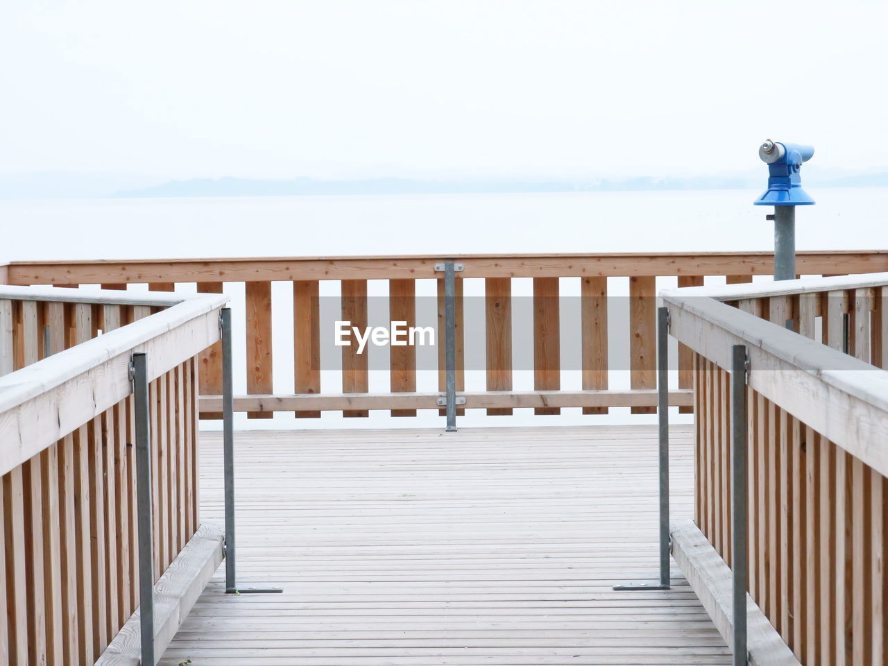 PIER ON BEACH AGAINST CLEAR SKY