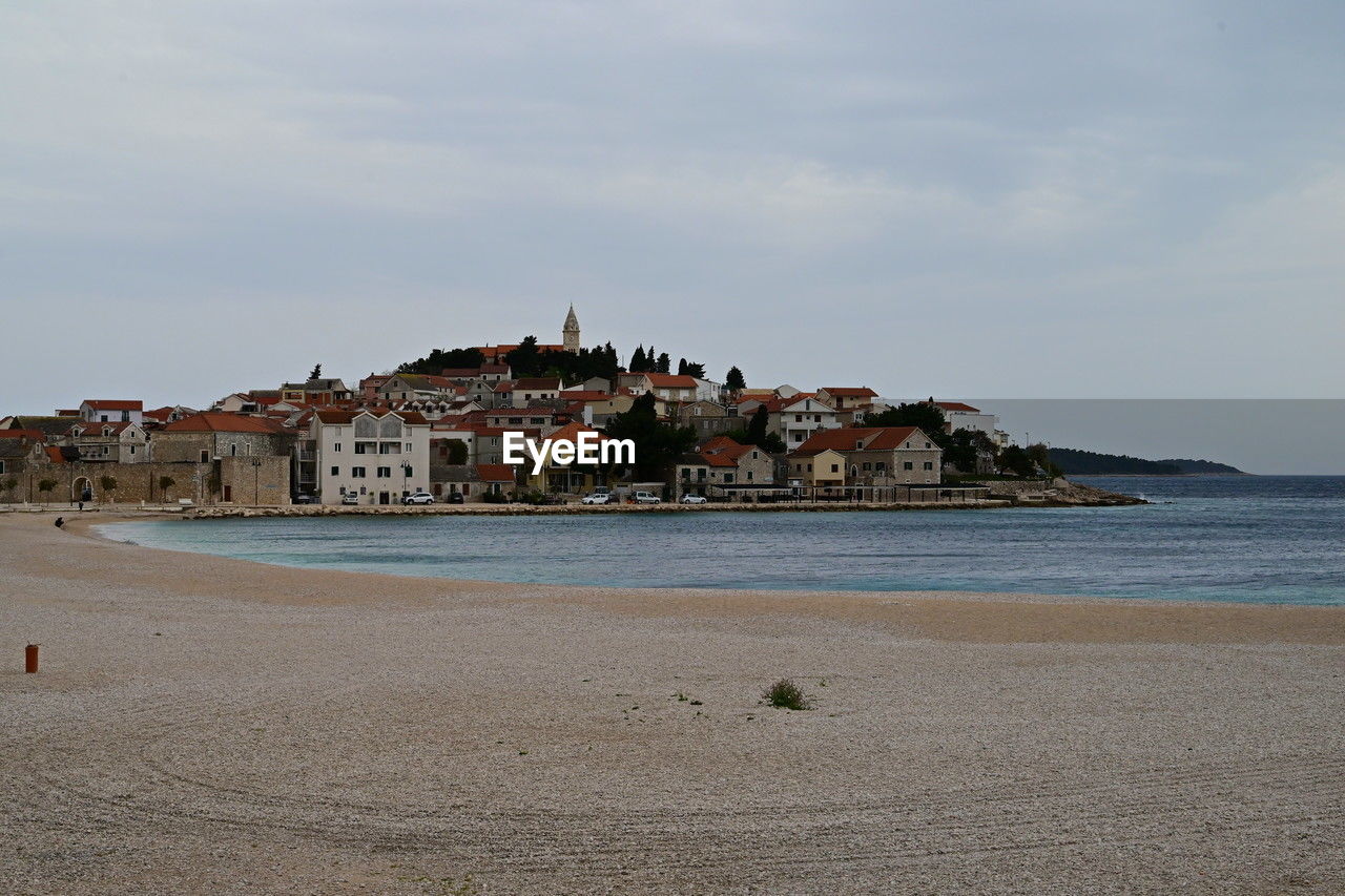 water, sea, coast, beach, architecture, land, sky, shore, ocean, building exterior, built structure, body of water, vacation, nature, building, travel destinations, cloud, travel, sand, city, tourism, bay, beauty in nature, scenics - nature, trip, day, horizon, coastline, outdoors, holiday, history, no people, house, the past, religion, tranquility
