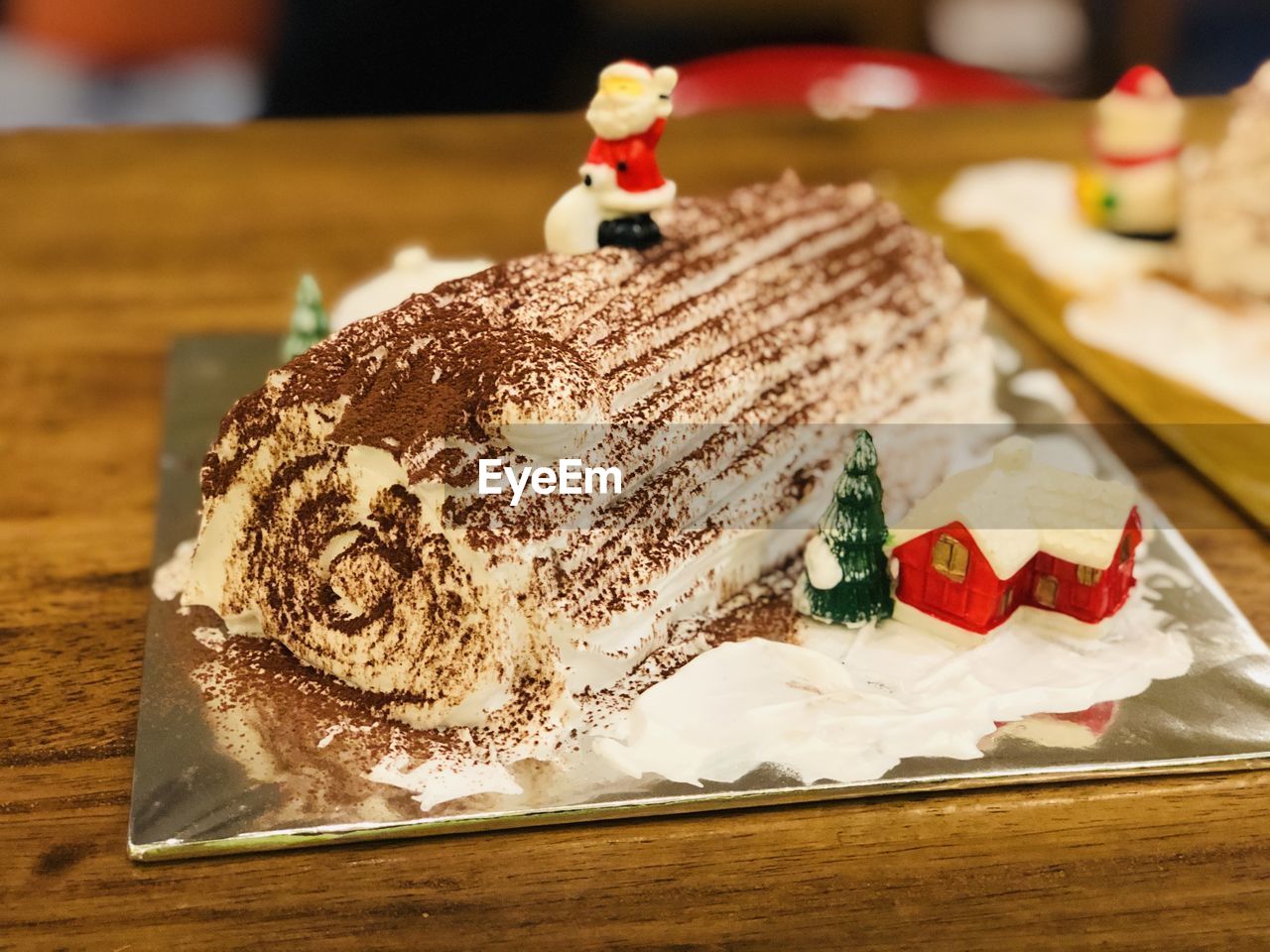 CLOSE-UP OF CAKE ON TABLE AGAINST THE WALL