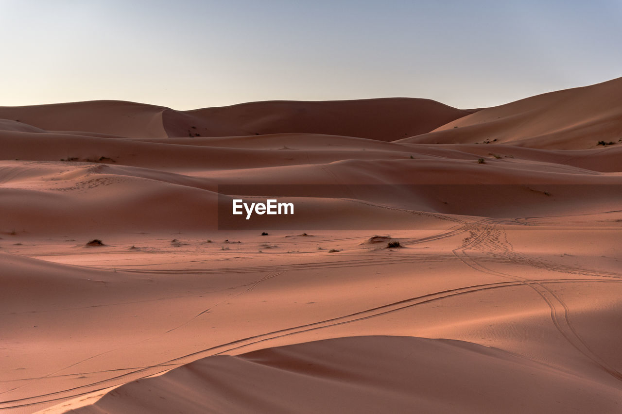 Scenic view of desert against clear sky