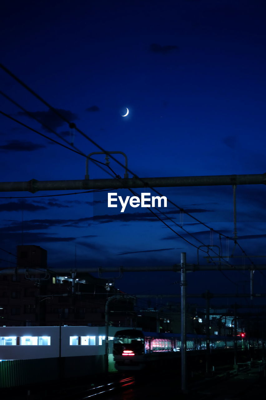 VIEW OF ILLUMINATED STREET LIGHT AT NIGHT