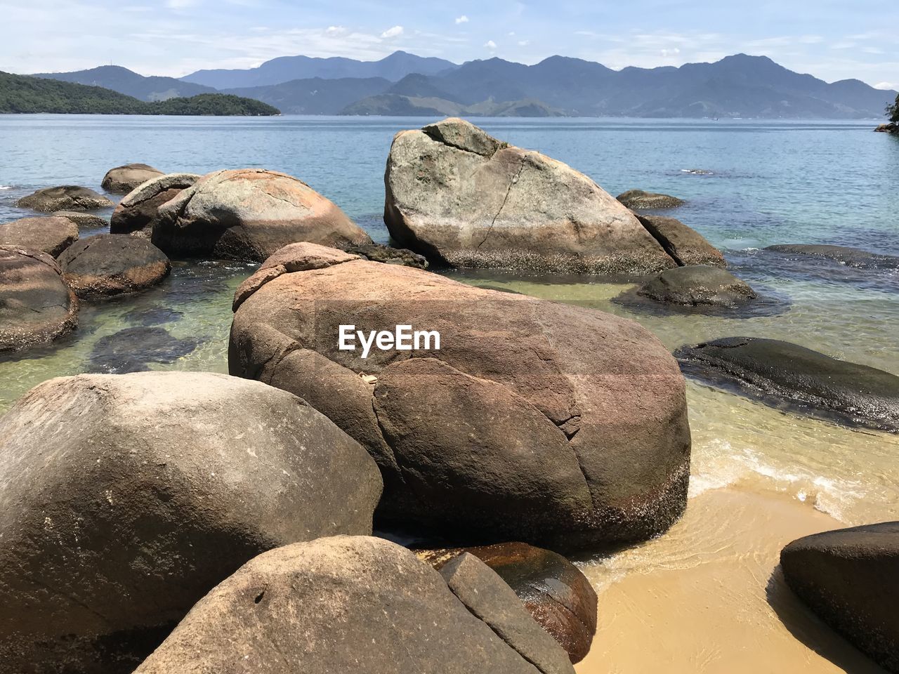 Rocks on sea shore against sky on ilha grande rio de janeiro 