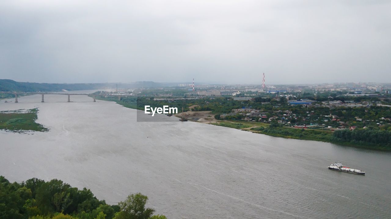 High angle view of city against cloudy sky