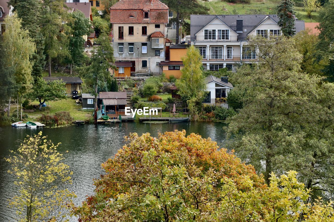 River amidst trees and buildings