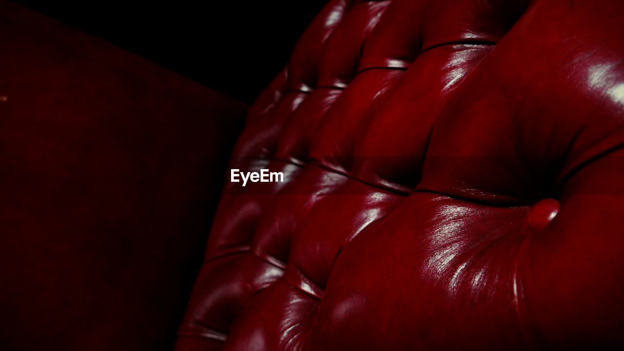 Full frame shot of red leather seat at movie theater