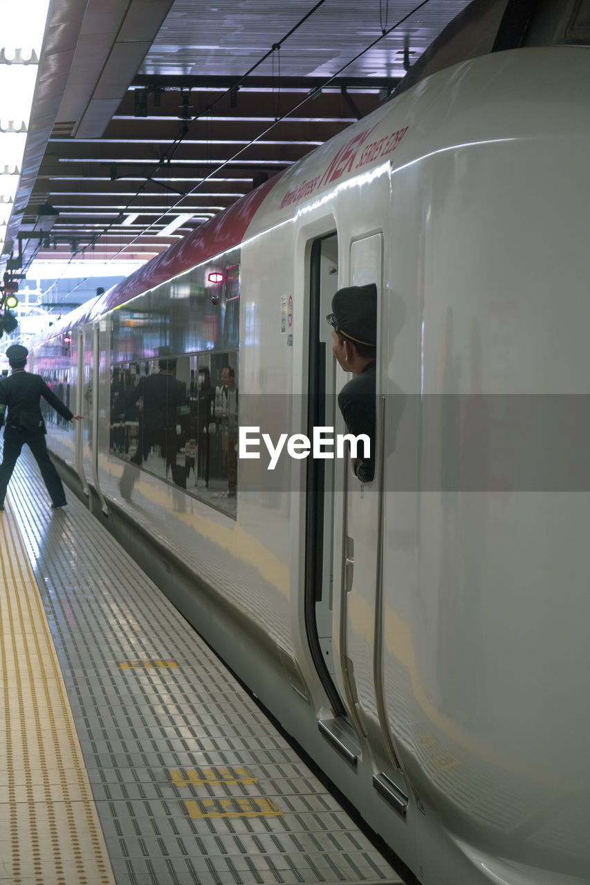 TRAIN IN RAILROAD STATION