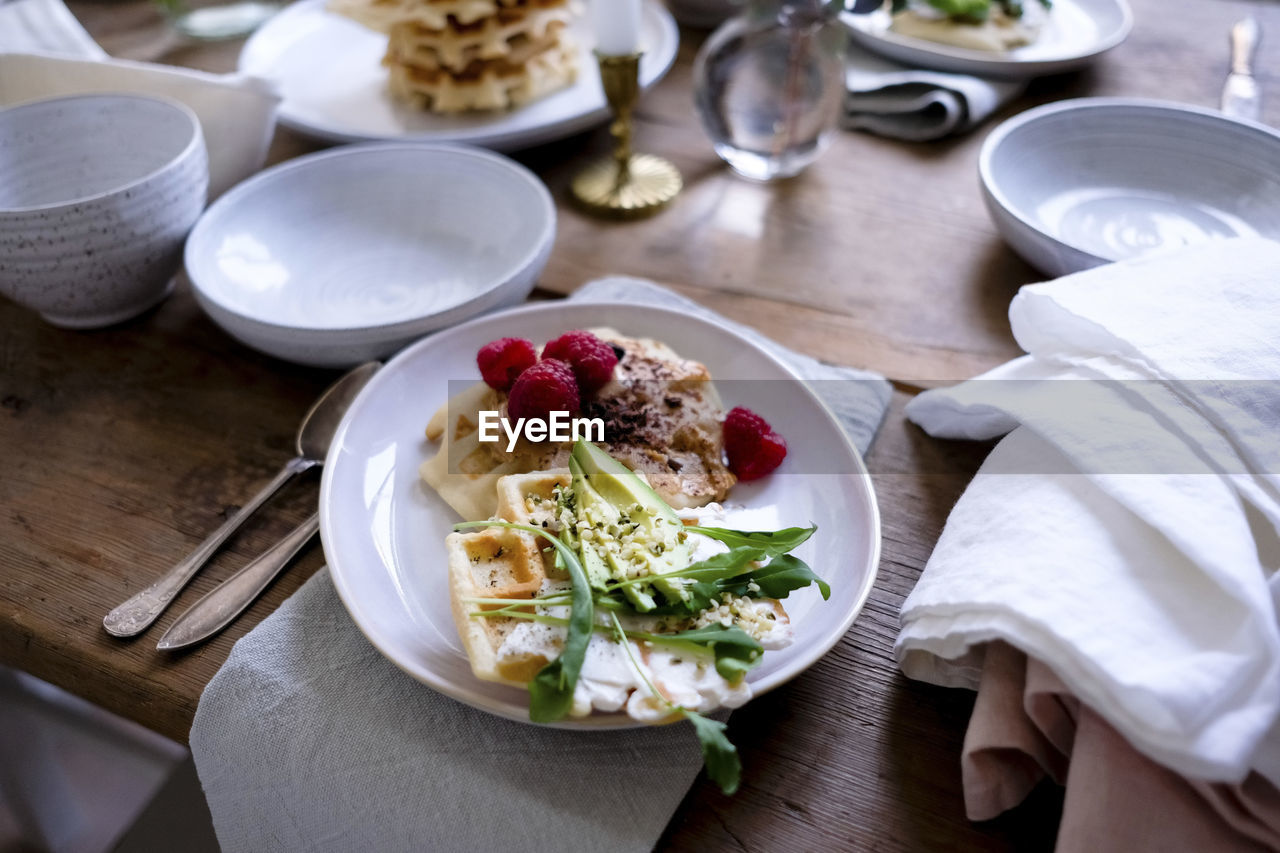 Close-up of food on plate at wooden table