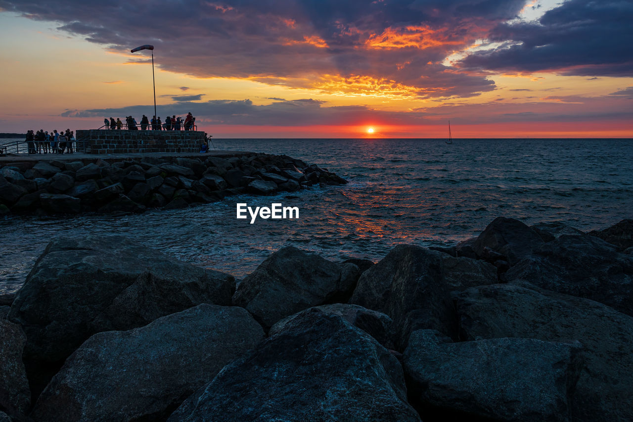 SCENIC VIEW OF BEACH DURING SUNSET