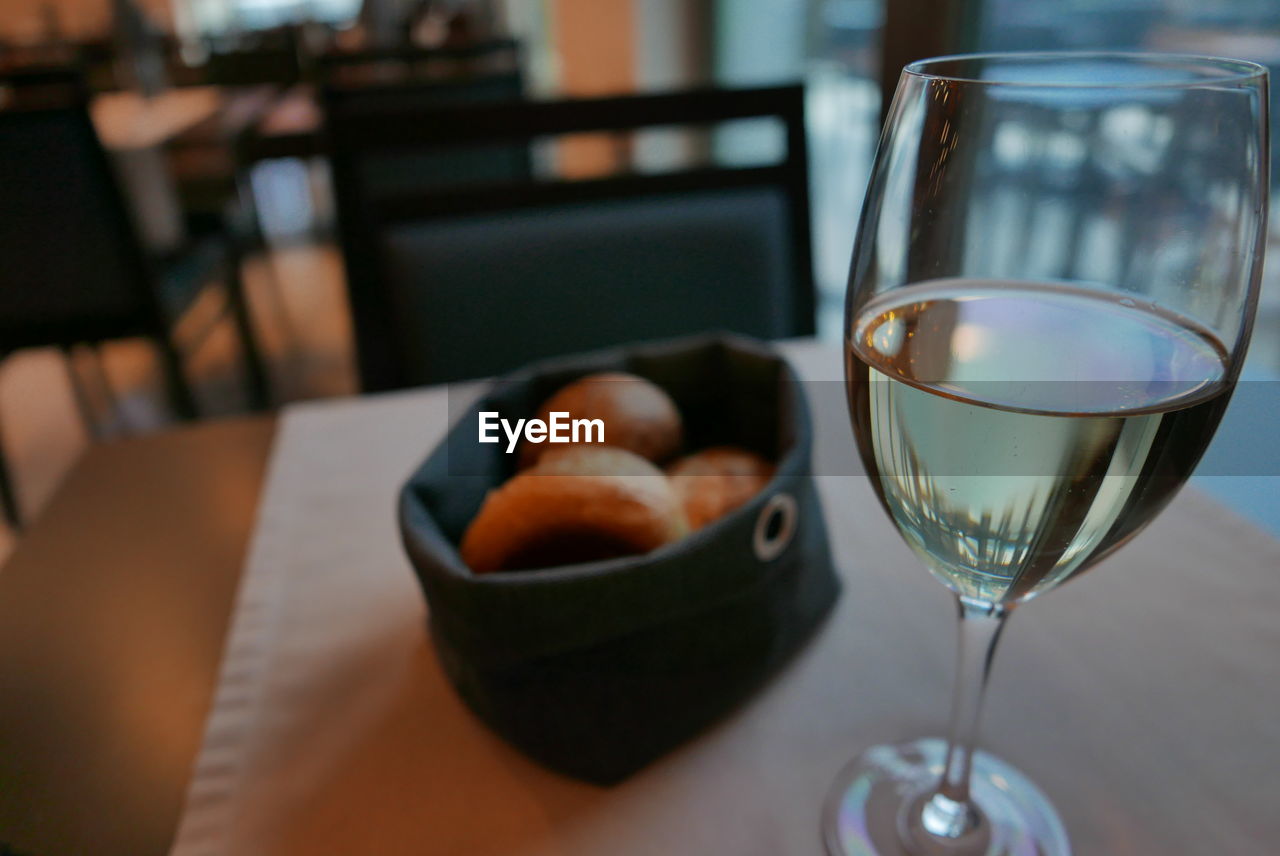 Close-up of wine in glass on table at restaurant