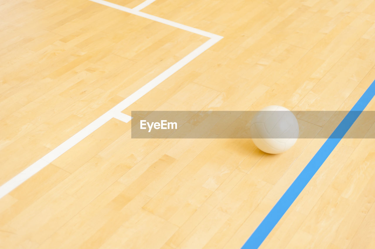 Close-up of on volleyball on court