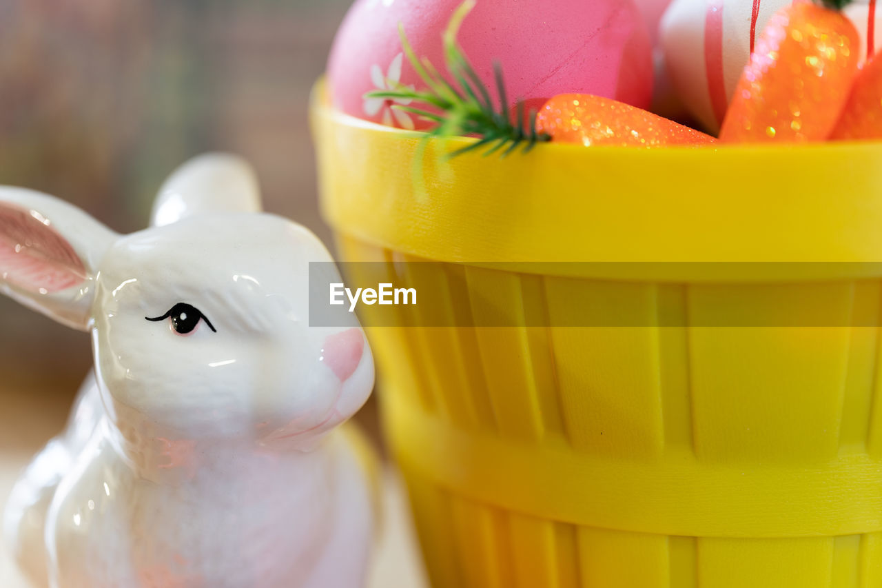 Close-up of easter eggs and rabbit display on table