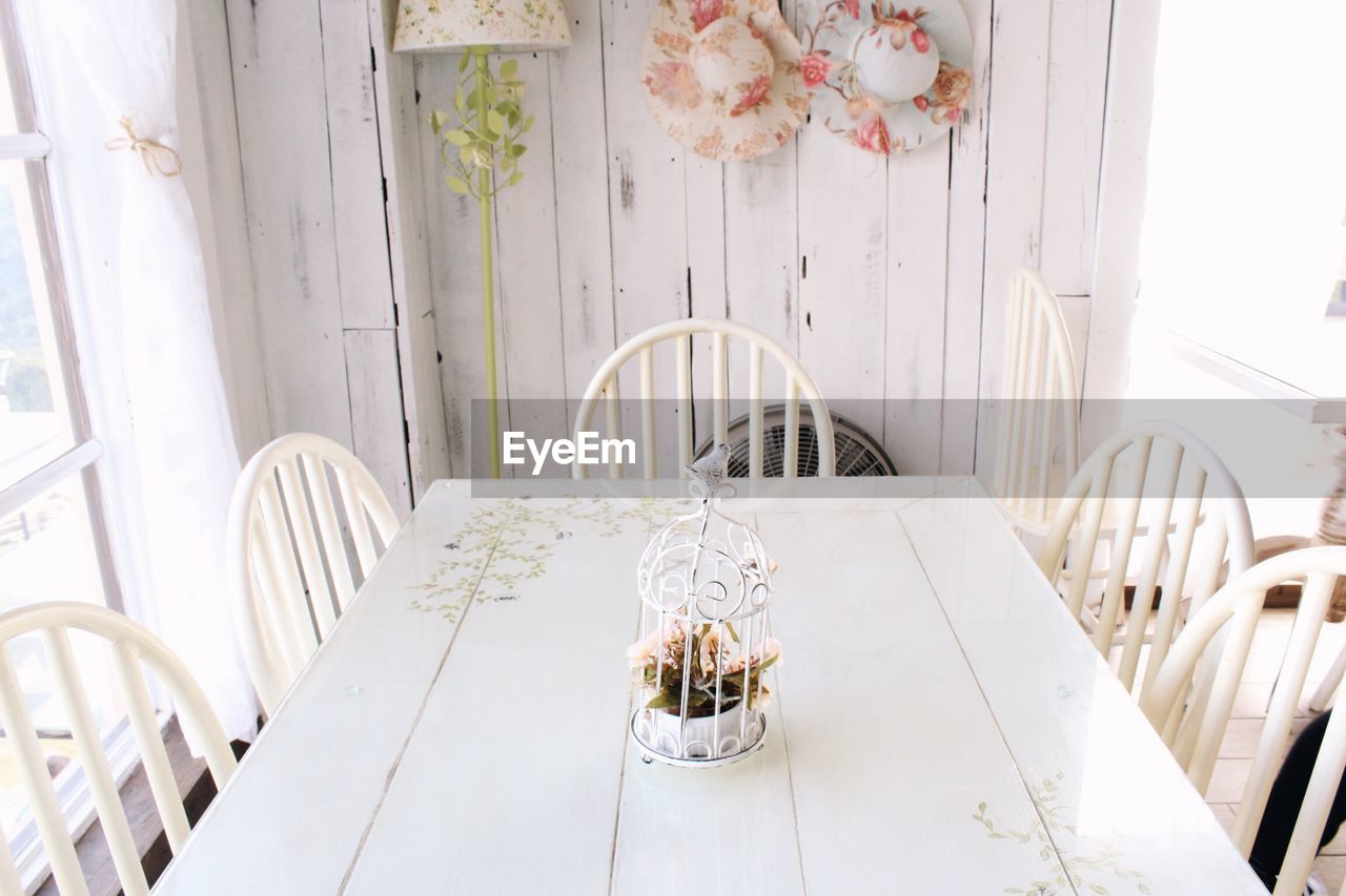 High angle view of white chairs and table