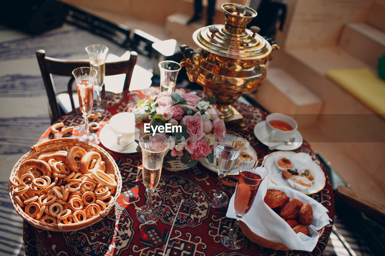 Baked food and drinks on table in restaurant