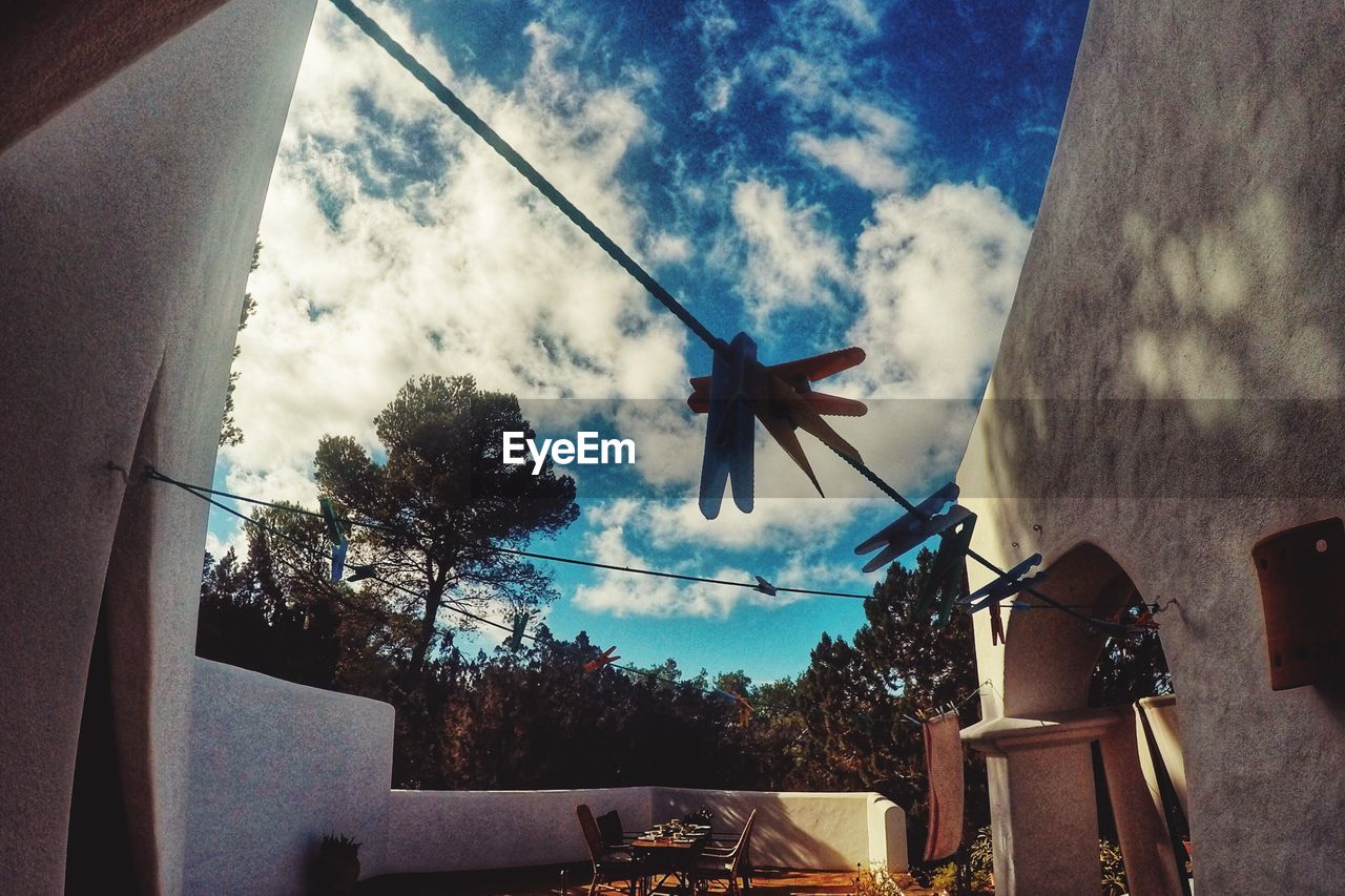 LOW ANGLE VIEW OF POWER LINES AGAINST SKY