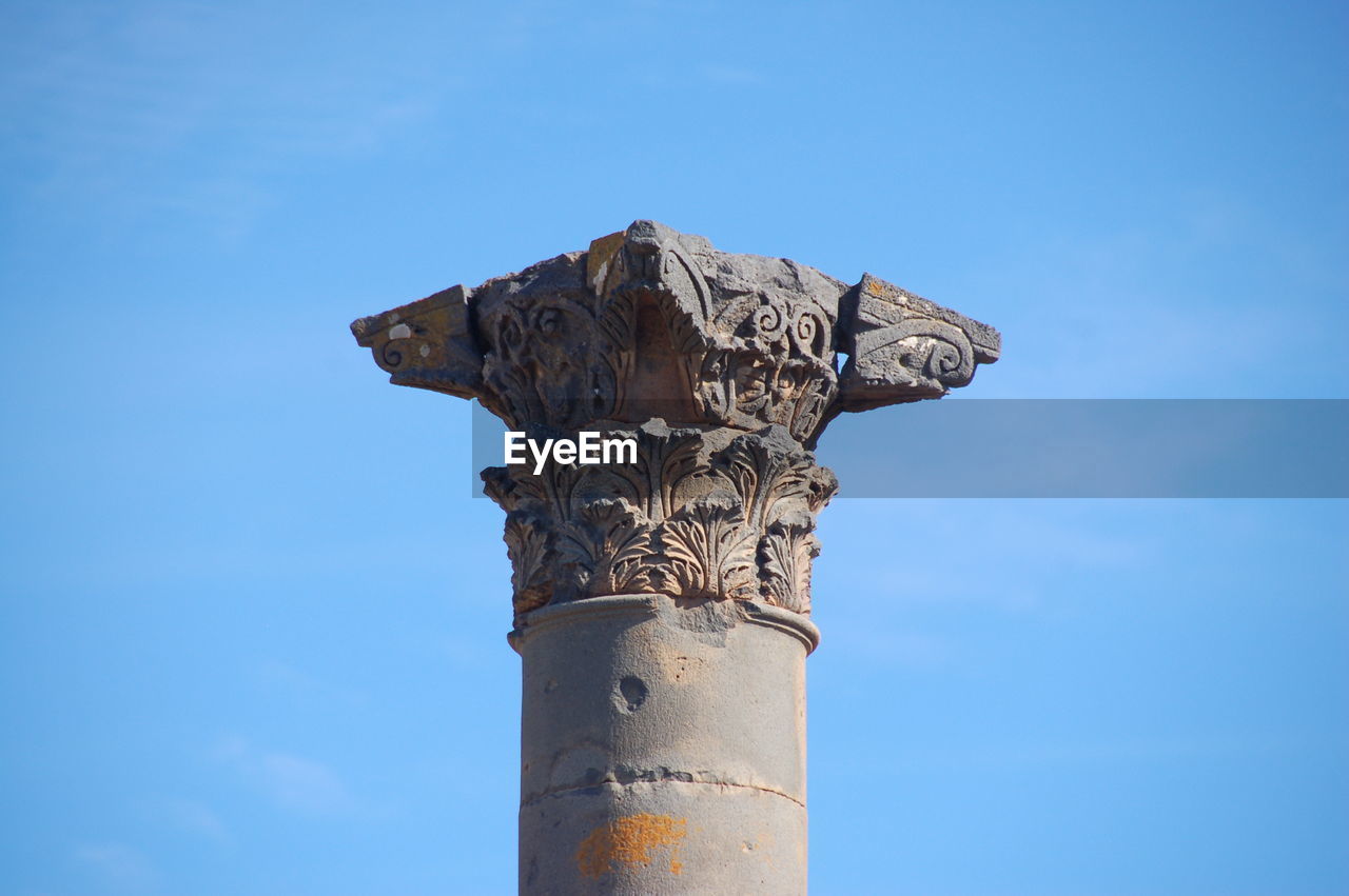 LOW ANGLE VIEW OF CROSS AGAINST BLUE SKY