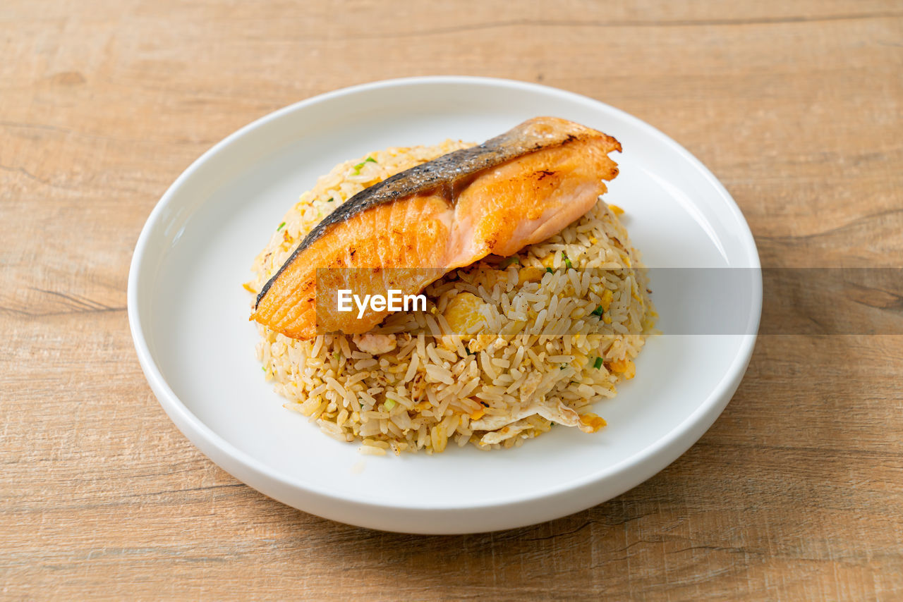 food and drink, food, healthy eating, plate, wood, wellbeing, freshness, dish, produce, meal, no people, table, fish, indoors, breakfast, vegetable, studio shot, crockery, rice - food staple, cuisine, rice, high angle view, fried rice