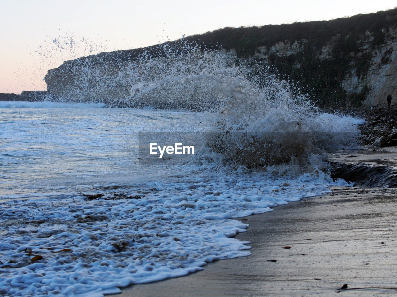 SCENIC VIEW OF SEA WITH ROCKS IN FOREGROUND