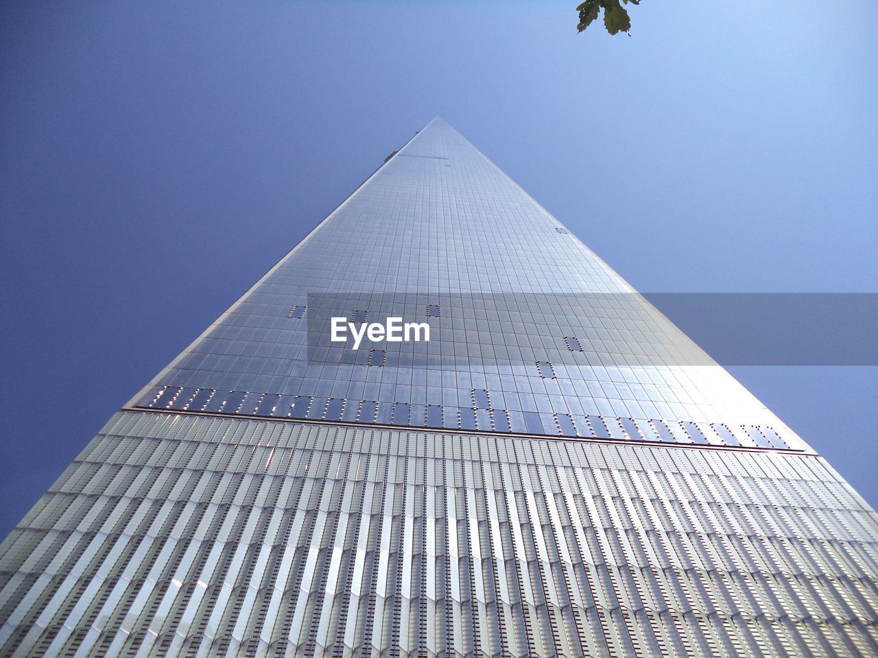 Low angle view of skyscrapers against clear sky - one world 