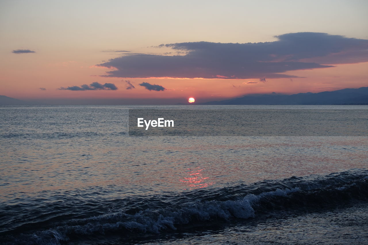 Scenic view of sea against sky during sunset