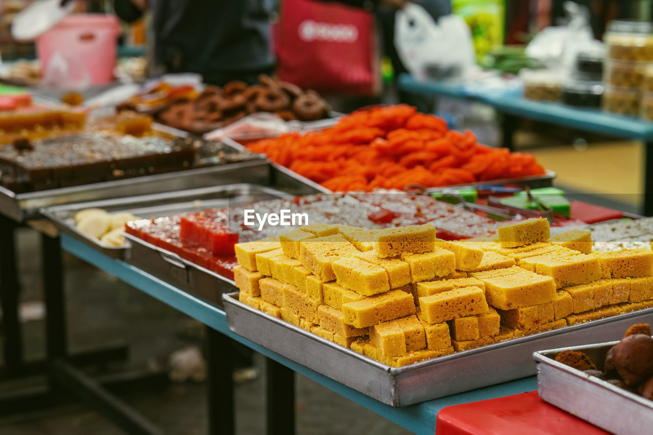 Indian assorted sweets or mithai for sale during deepavali or diwali festival at the market.