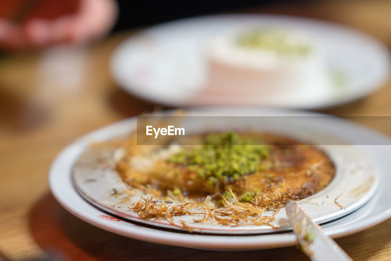 CLOSE-UP OF FOOD SERVED ON TABLE