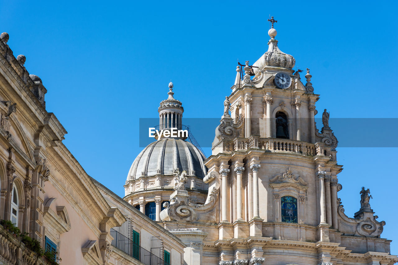 Low angle view of church against blue sky