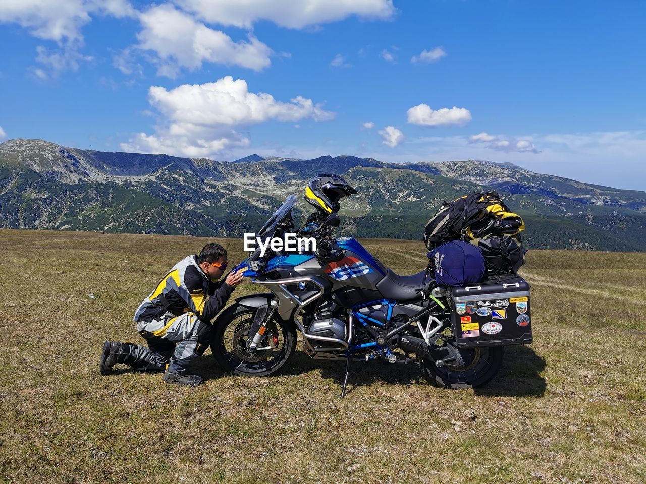 PEOPLE RIDING BICYCLES ON MOUNTAIN