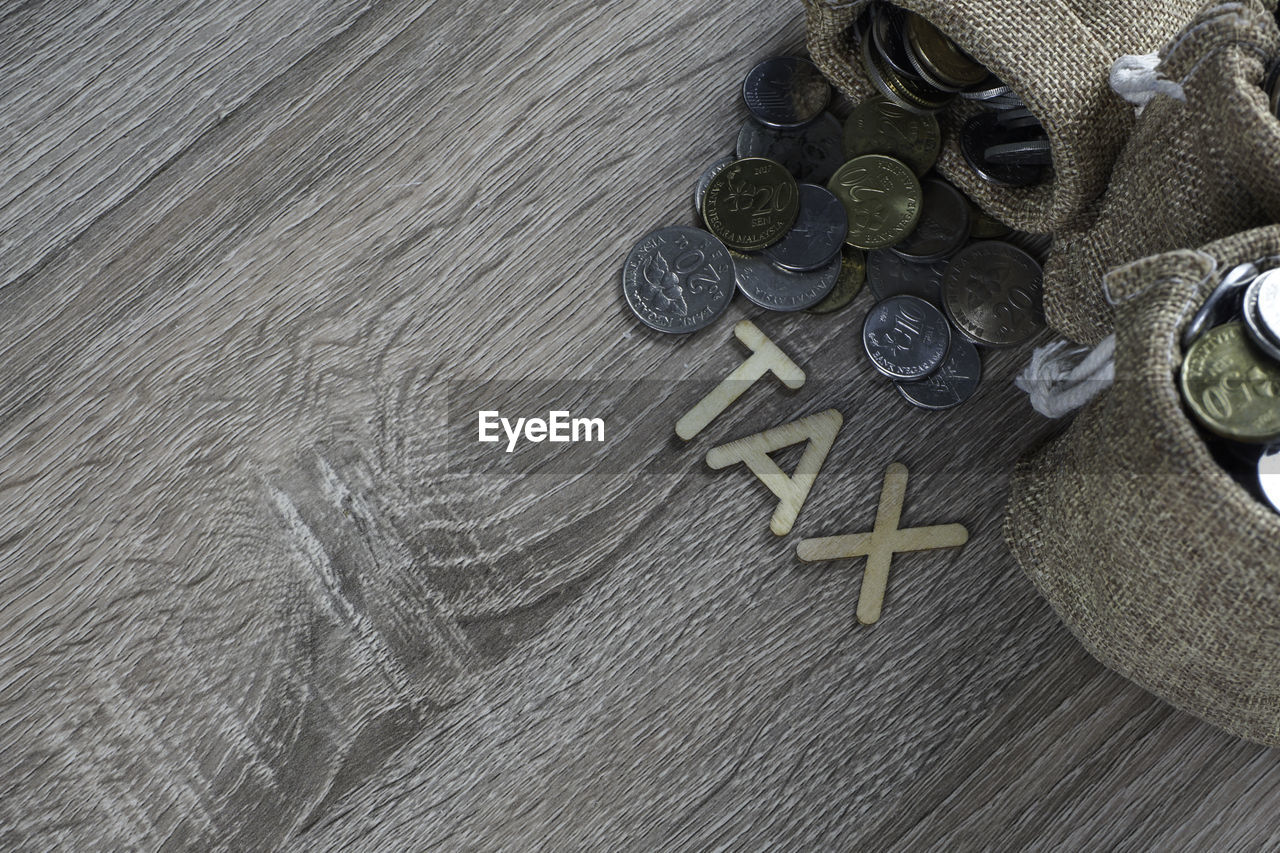 High angle view of coins on table