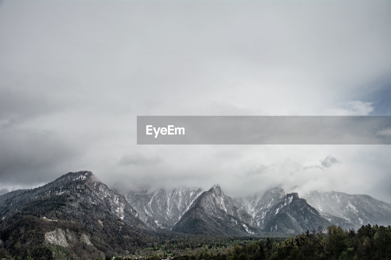 Scenic view of snowcapped mountains against sky