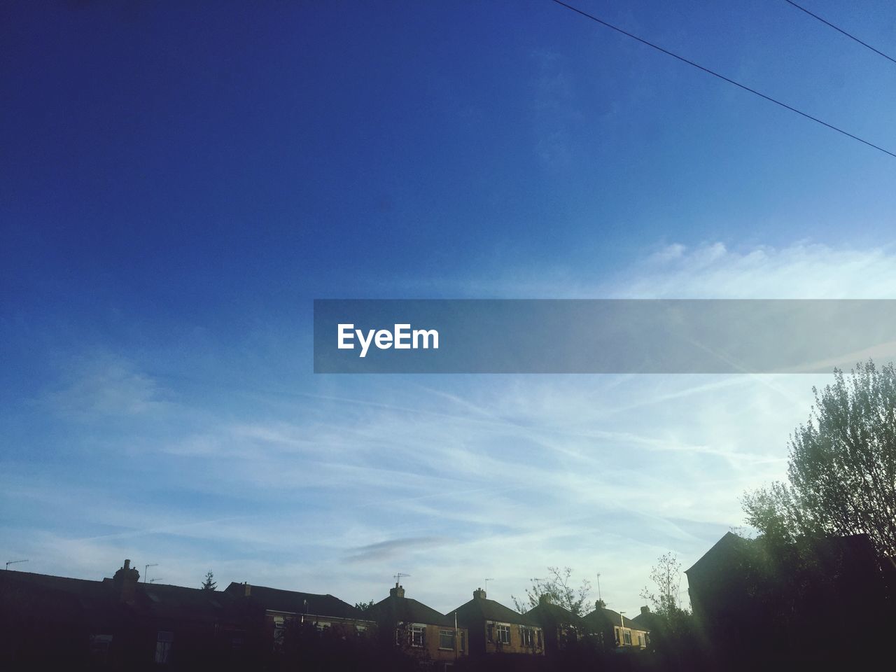 BUILDINGS AGAINST BLUE SKY