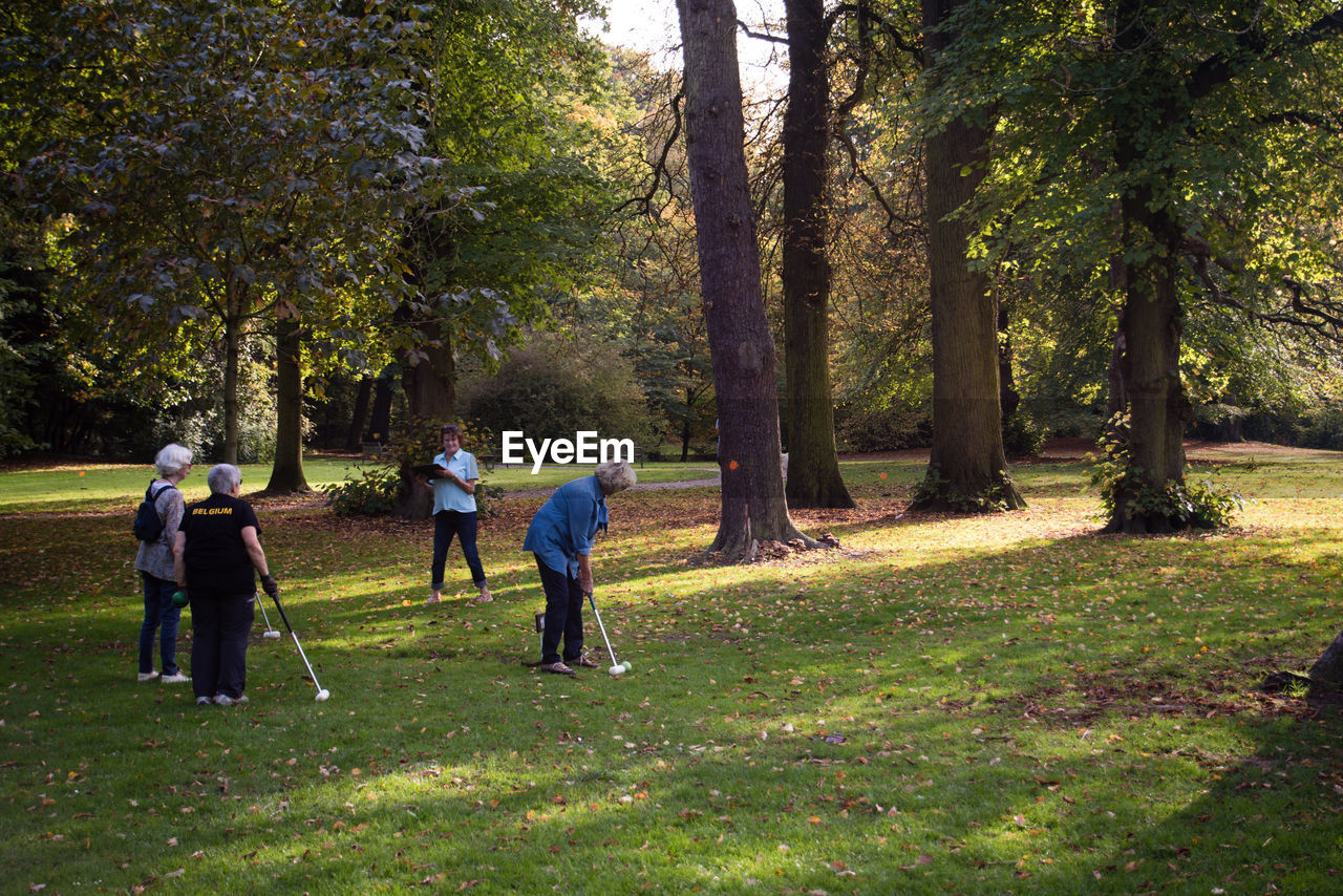 MAN WALKING IN FOREST