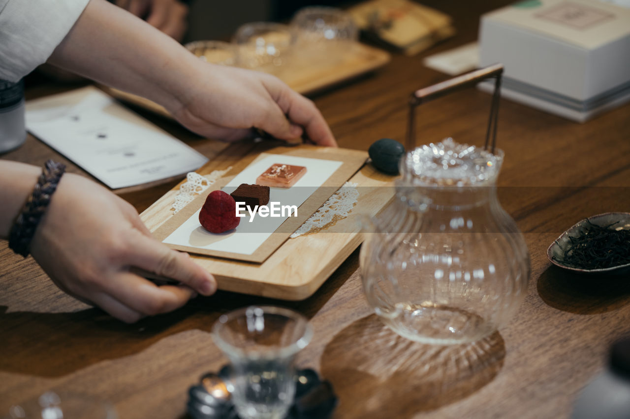 Midsection of woman preparing food on table