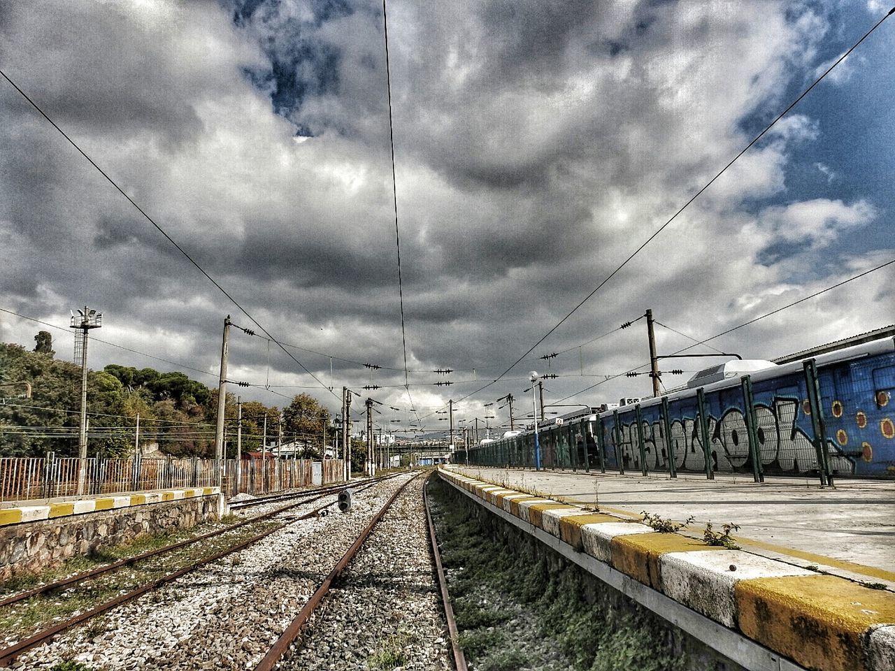 RAILROAD TRACK AGAINST SKY