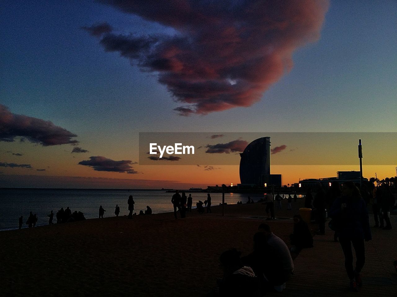 PEOPLE ON BEACH DURING SUNSET