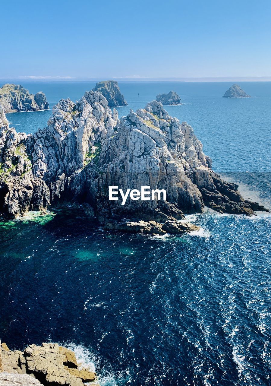 Panoramic view of sea against blue sky