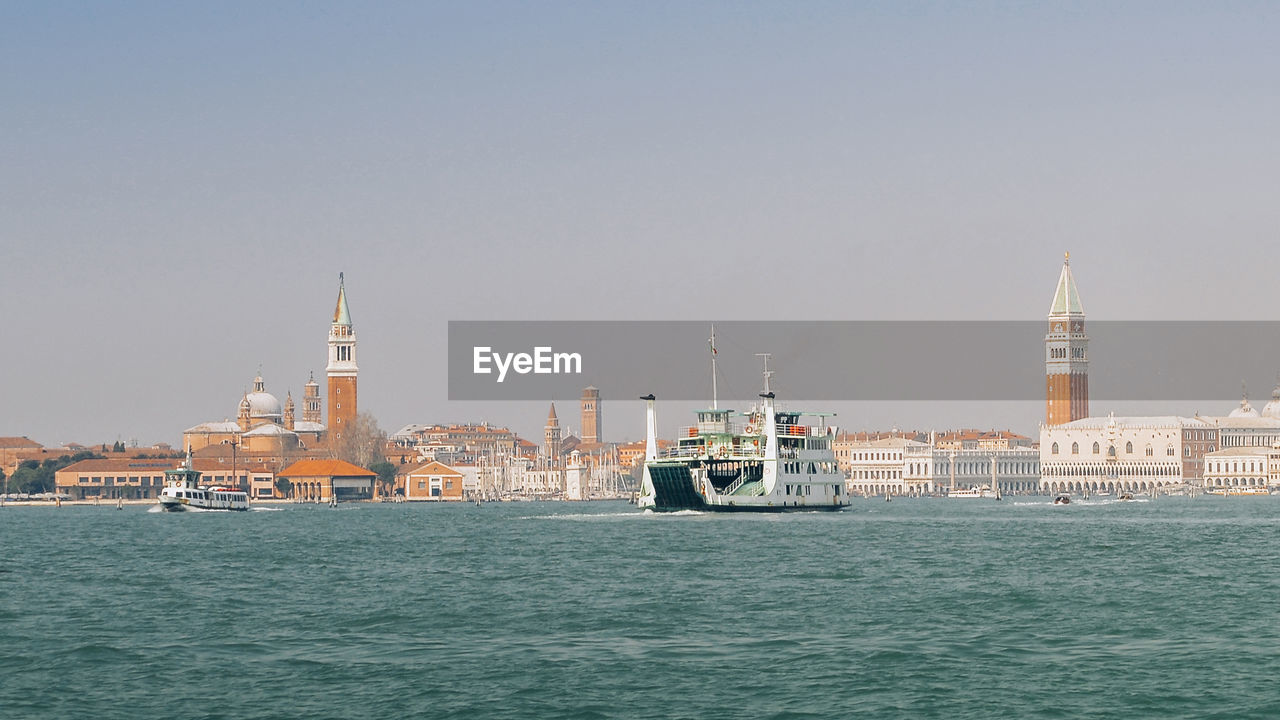 VIEW OF SEA AGAINST BUILDINGS