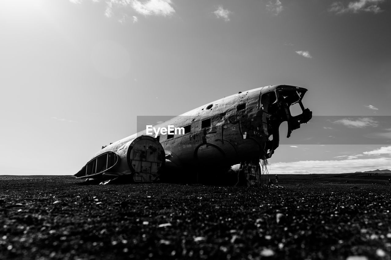 low angle view of airplane on road against sky