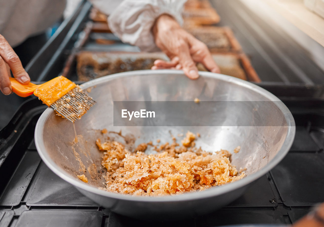 midsection of man preparing food in kitchen