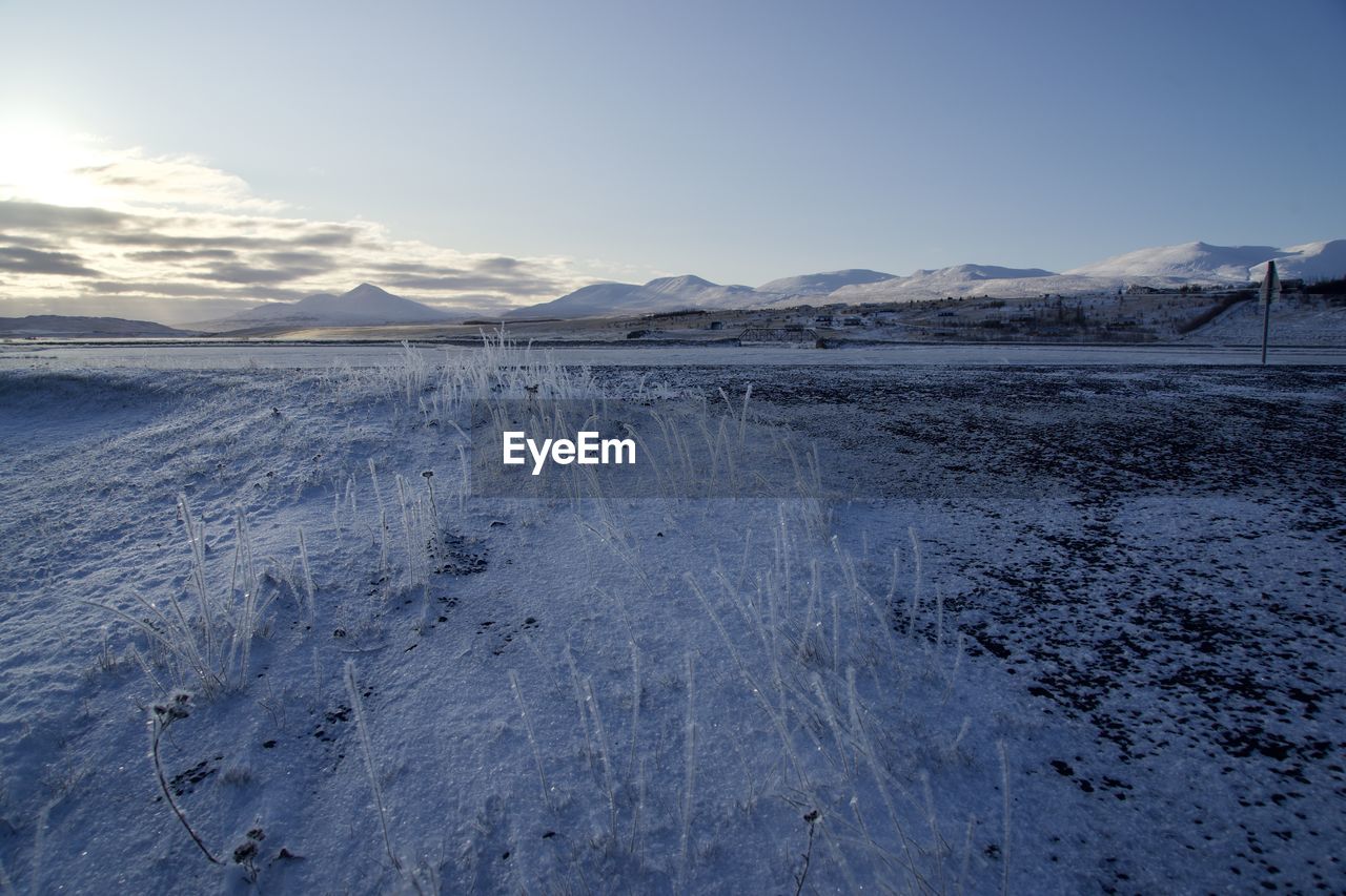 Scenic view of snowcapped mountains against sky