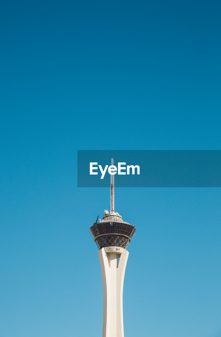 Low angle view of stratosphere against clear blue sky during sunny day