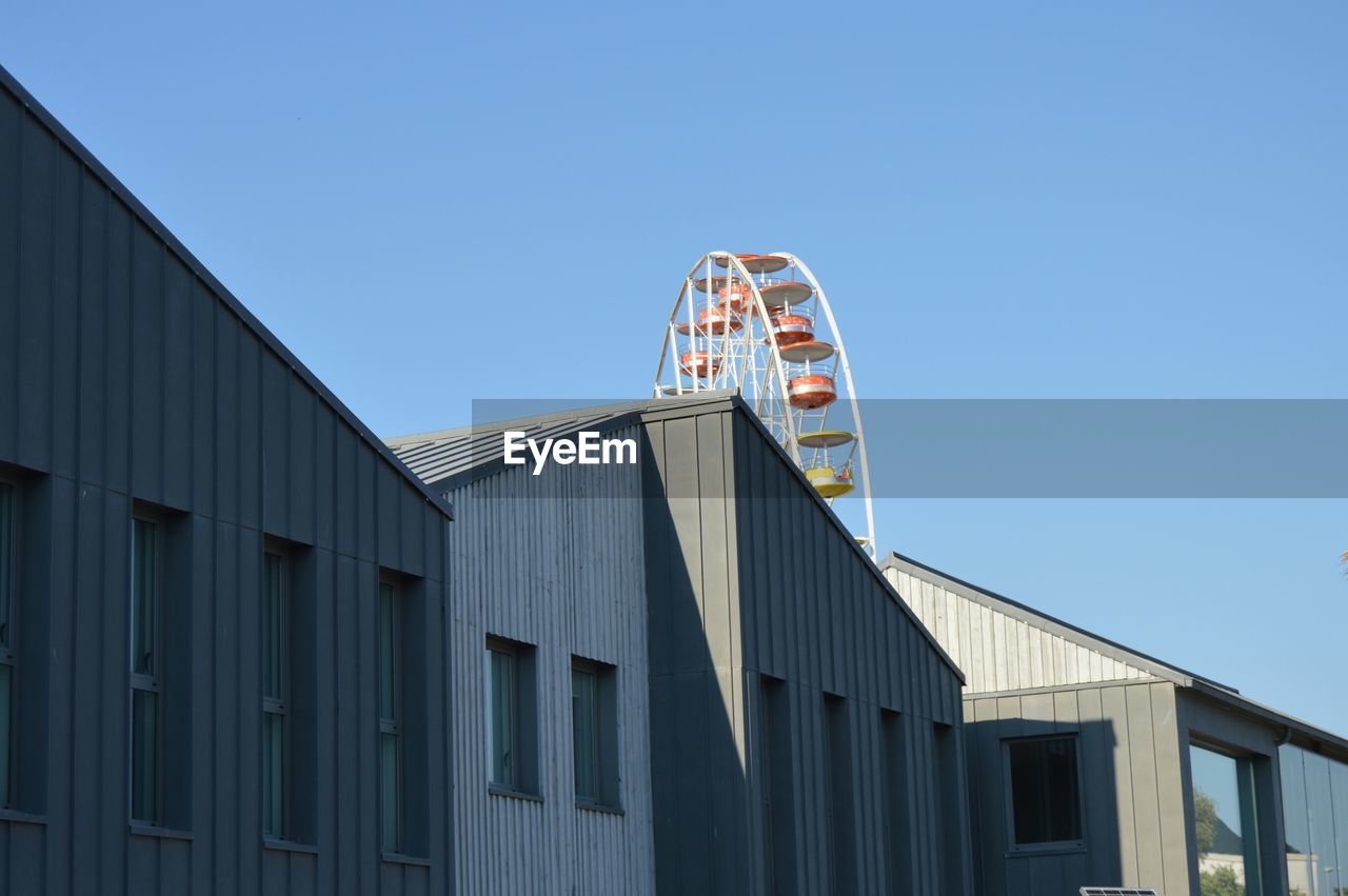 VIEW OF BUILDING AGAINST CLEAR BLUE SKY