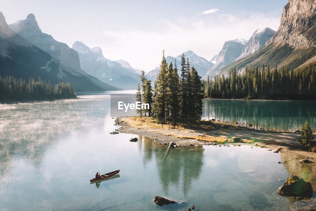 View of calm lake against mountain range