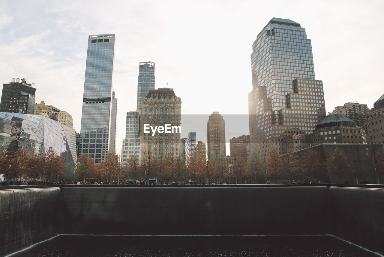 Skyscrapers in city against sky