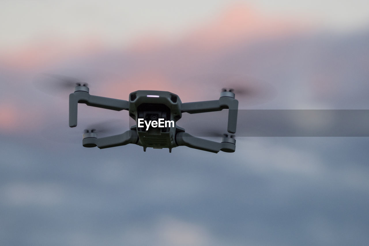 Low angle view of camera against sky during sunset